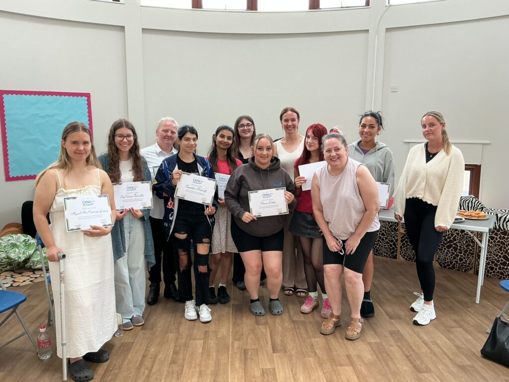 Group photo of students holding certificates